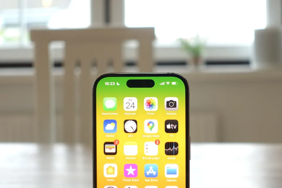 a cell phone with a yellow screen