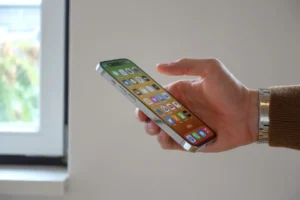 a hand holding a cell phone