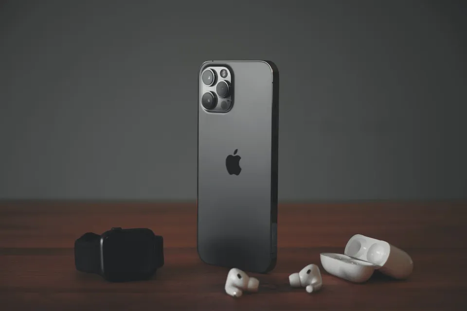 an iphone and earphones on a table