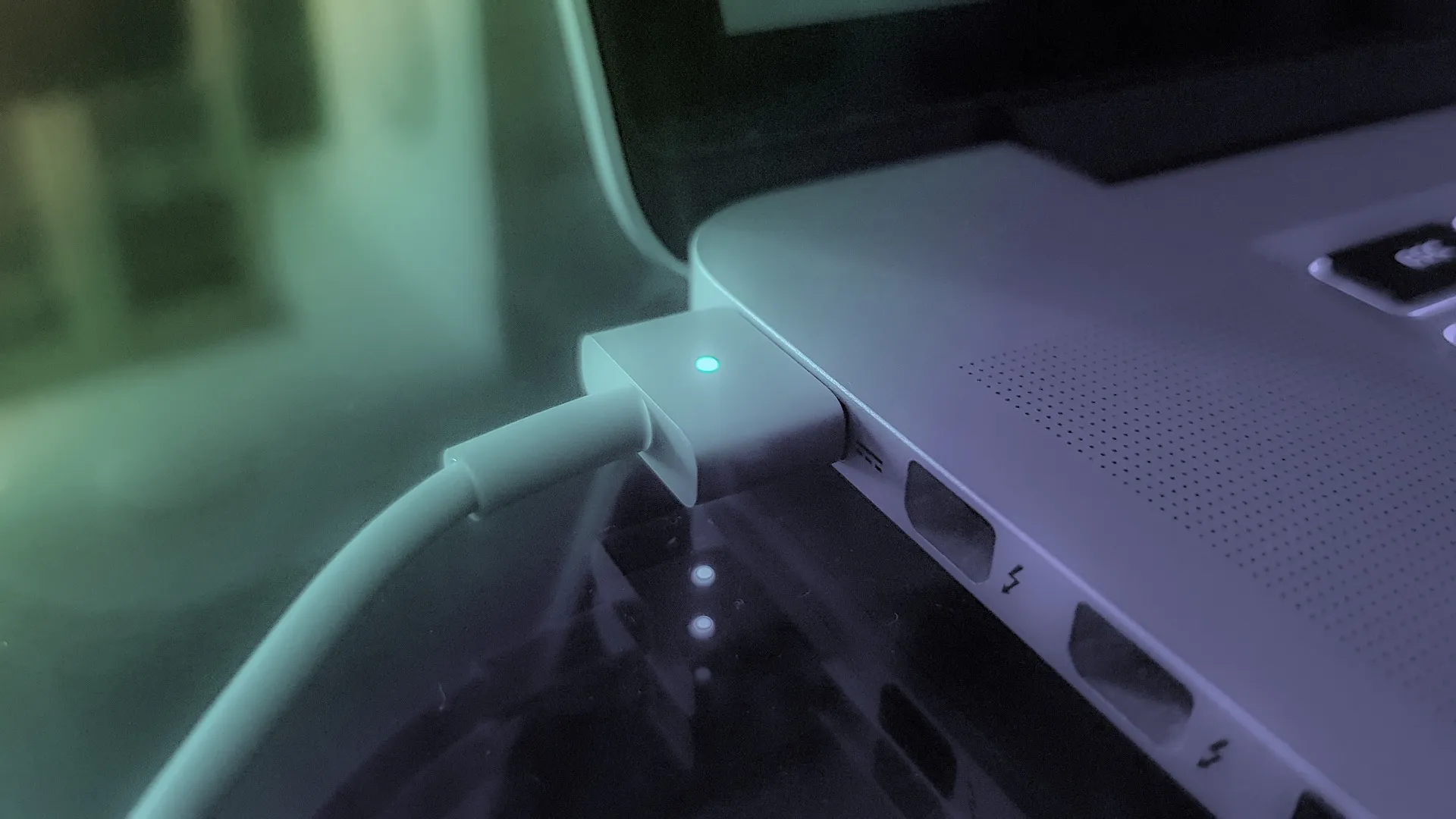 a close-up of a laptop being charging 