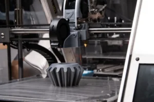 3D printer creating a machine with precision.