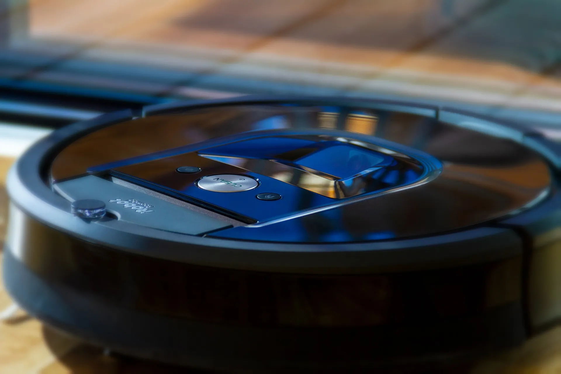 A robotic vacuum cleaner, placed on a wooden table, enhances the home cleaning routine.