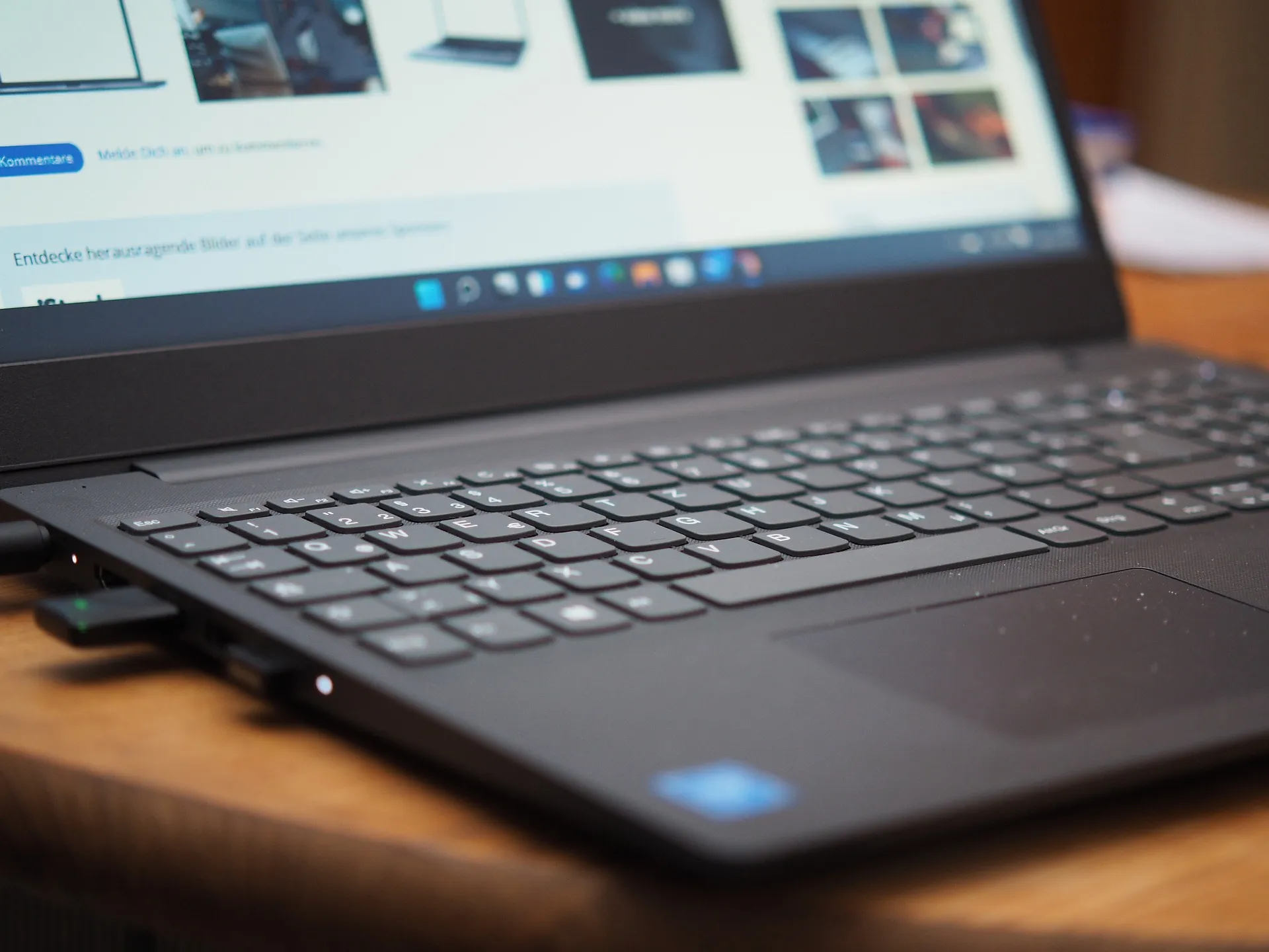 a laptop on a table
shows Software of Windows, iPadOS, and MacOS