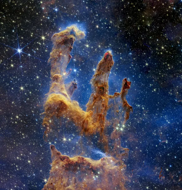 The Eagle Nebula, a star cluster in space, captured by the James Webb Space Telescope.