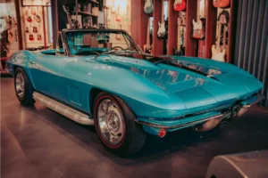 Sleek blue Corvette in indoor parking.