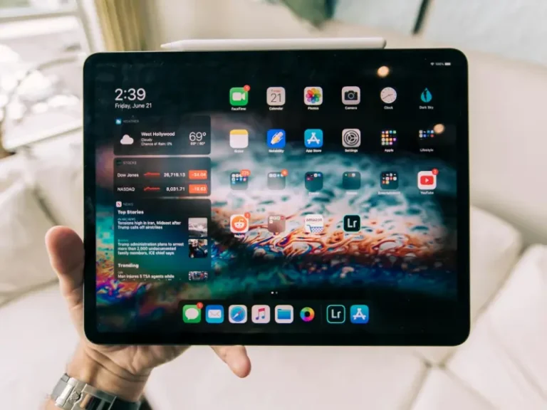 a person holding a iPad.