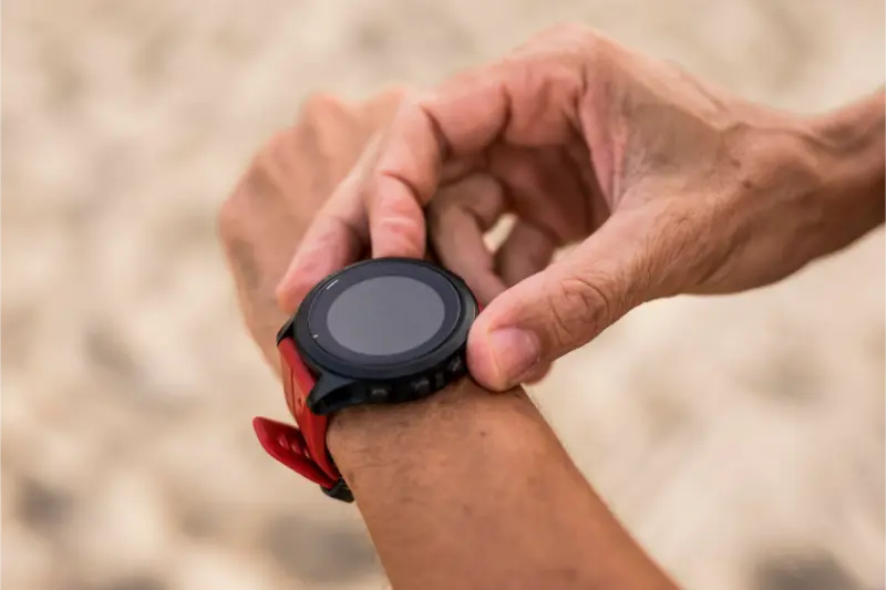 A person wearing a smart watch on their wrist.