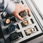 Hand selecting from a collection of the best luxury sport watches.