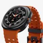 Galaxy Watch Ultra with orange strap, showcasing advanced features.