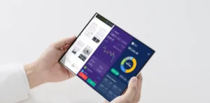 Person holding a futuristic foldable phone with a multitasking display.